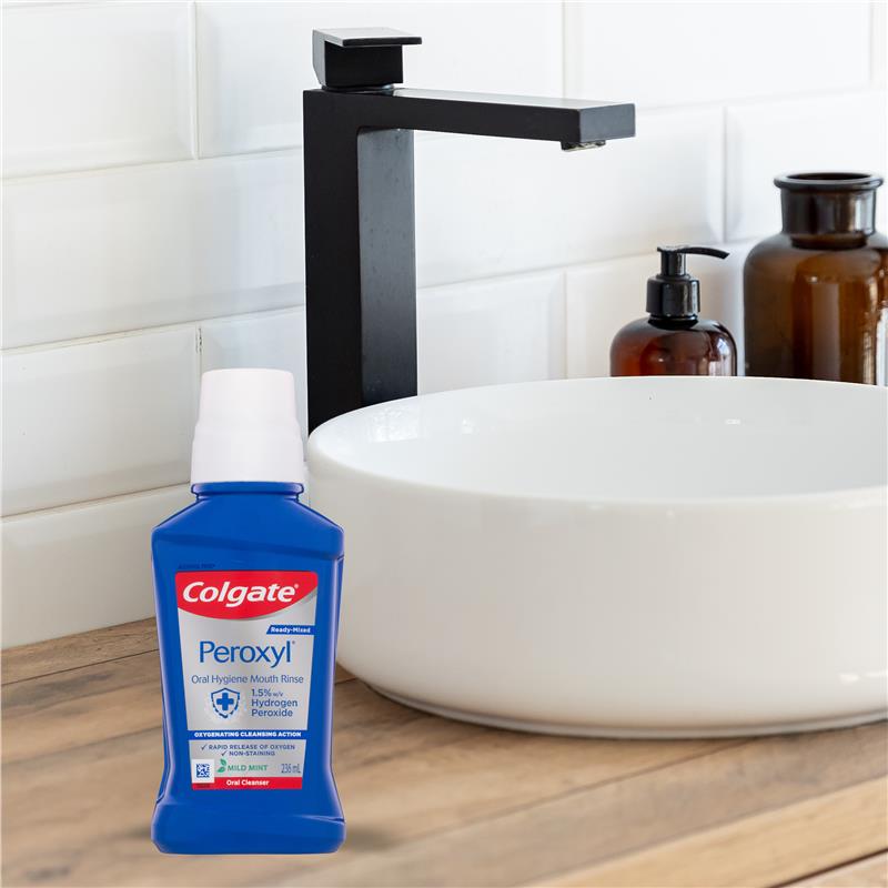 Load image into Gallery viewer, Colgate Peroxyl Oral Cleanser Mint Flavour 236mL
