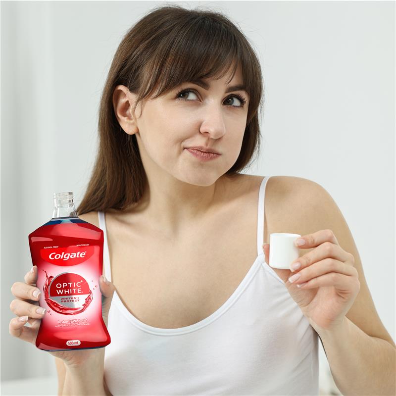 Load image into Gallery viewer, Colgate Optic White Teeth Whitening Mouthwash with Optic Brightener, Alcohol Free 500mL
